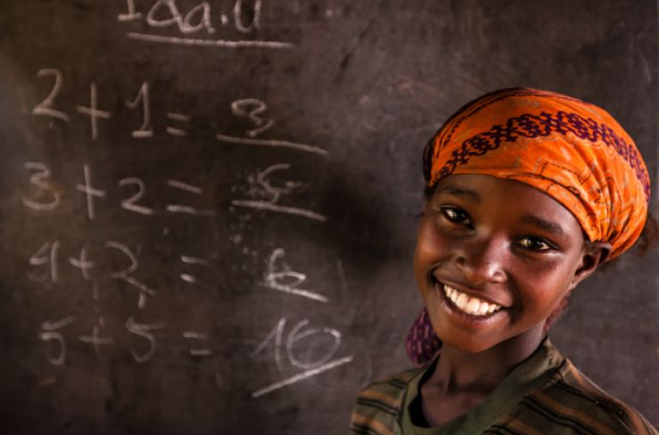 girl in front of chalkboard