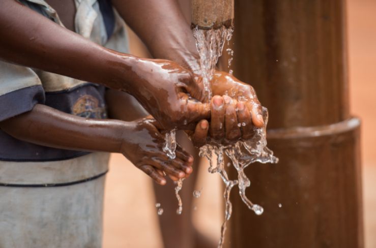 washing hands under water